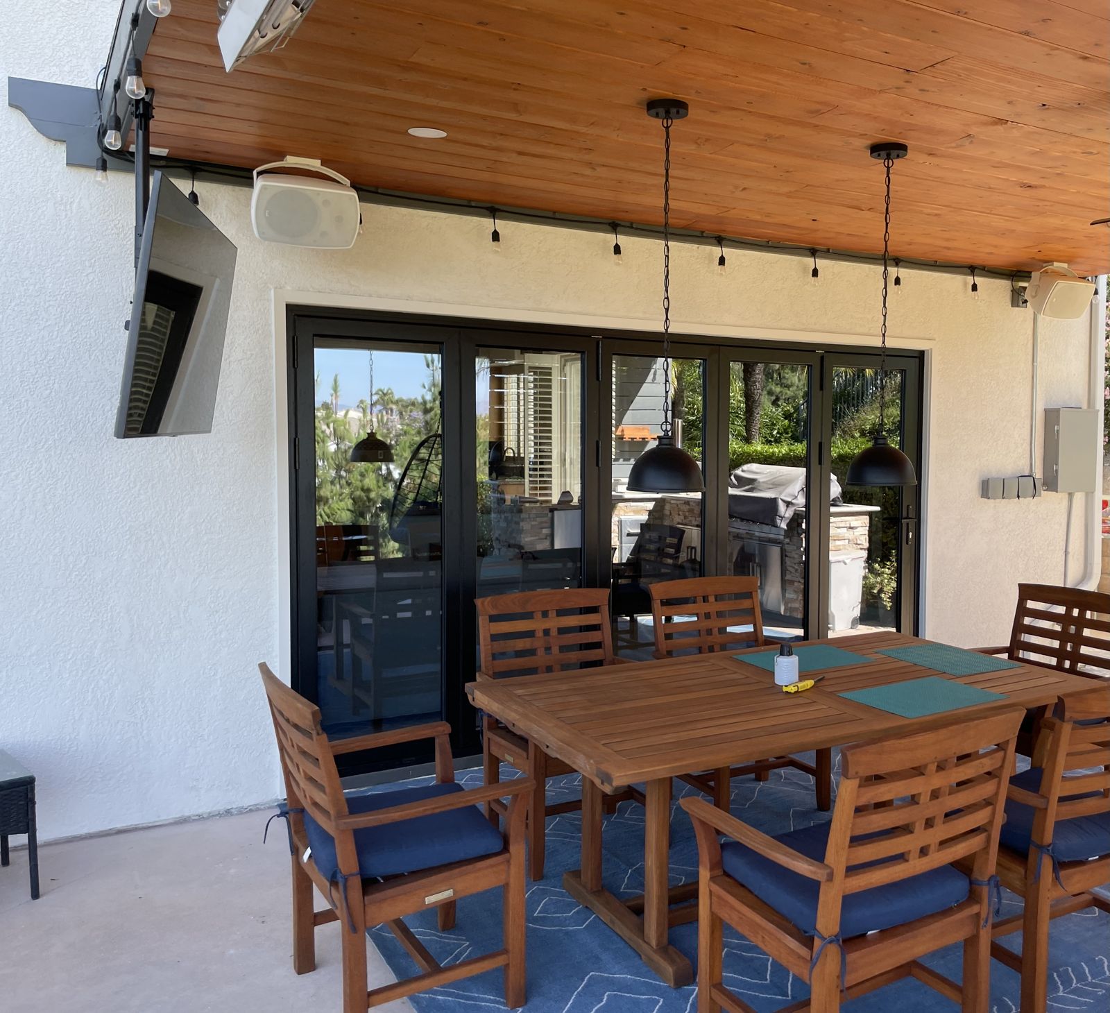 Finished covered patio with dining table
